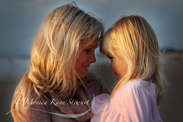 mother and daughter angels at sunset